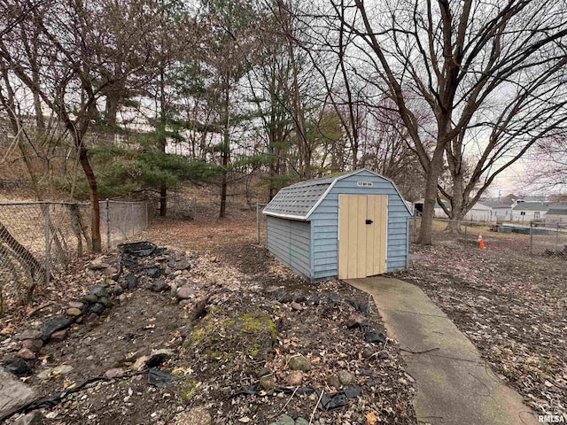 view of shed with fence