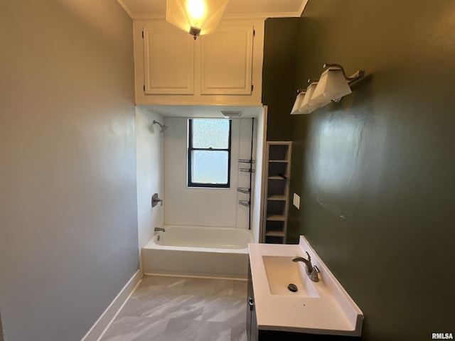 full bath featuring baseboards, bathing tub / shower combination, and vanity