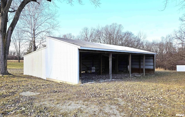 garage featuring a detached carport
