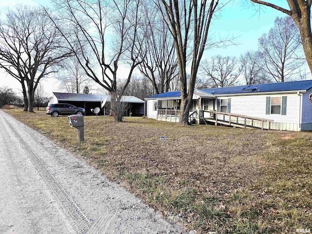 view of front facade featuring a porch and metal roof