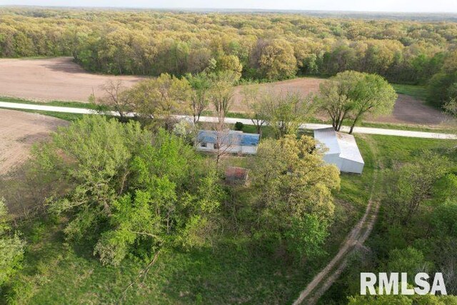 view of property exterior with a sunroom