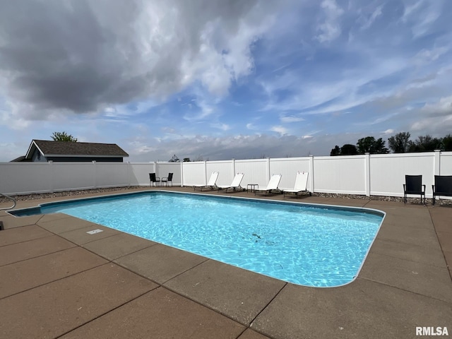 922 W Scott St, Eldridge, IA 52748 - view of swimming pool with a fenced in pool, fence, and a patio
