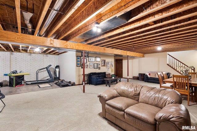 922 W Scott St, Eldridge, IA 52748 - living room with stairway and brick wall