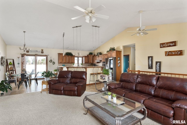 922 W Scott St, Eldridge, IA 52748 - living room featuring light tile patterned floors, high vaulted ceiling, ceiling fan with notable chandelier, and light colored carpet