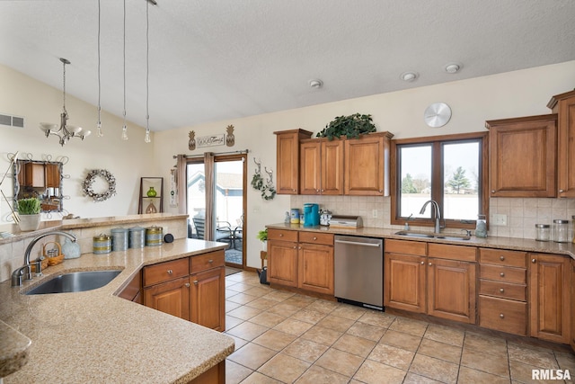 922 W Scott St, Eldridge, IA 52748 - kitchen featuring a sink, vaulted ceiling, brown cabinets, and dishwasher