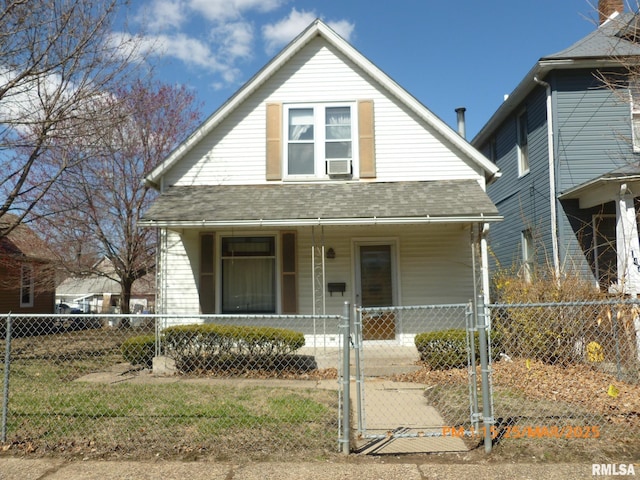 145 6th Ave, Moline, IL 61265 - bungalow with a porch, a fenced front yard, a gate, and a shingled roof