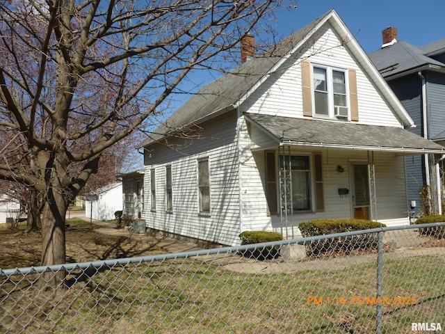 145 6th Ave, Moline, IL 61265 - view of front facade with a chimney, a porch, and roof with shingles