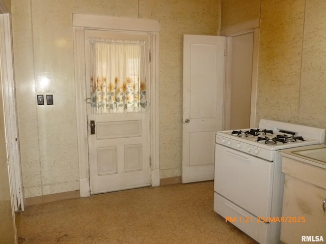 145 6th Ave, Moline, IL 61265 - kitchen with white gas range and light countertops