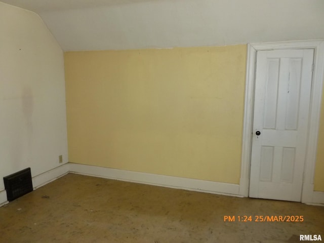 145 6th Ave, Moline, IL 61265 - spare room featuring vaulted ceiling and baseboards