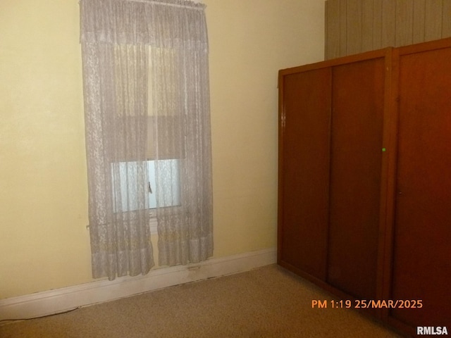 145 6th Ave, Moline, IL 61265 - unfurnished bedroom featuring carpet and baseboards