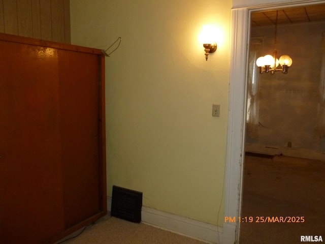 145 6th Ave, Moline, IL 61265 - hall with a chandelier and light colored carpet