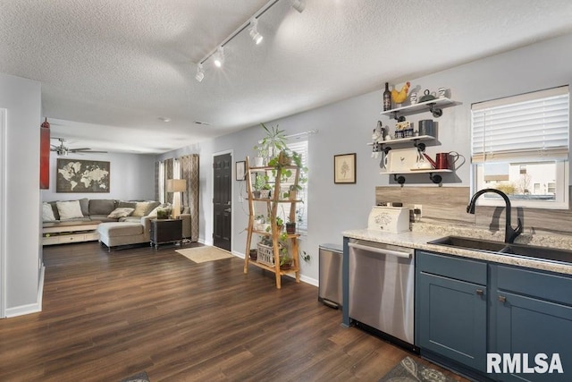 1708 Westport Dr, Davenport, IA 52804 - kitchen with stainless steel dishwasher, open shelves, rail lighting, a sink, and dark wood finished floors