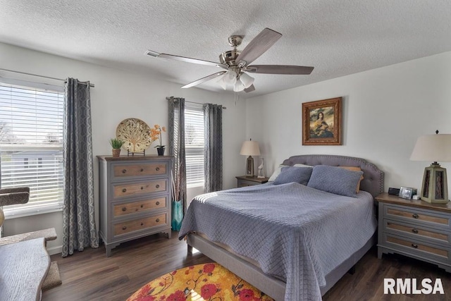 1708 Westport Dr, Davenport, IA 52804 - bedroom with a textured ceiling, baseboards, a ceiling fan, and wood finished floors