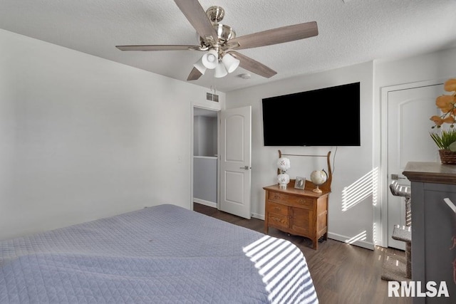 1708 Westport Dr, Davenport, IA 52804 - bedroom featuring a textured ceiling, a ceiling fan, wood finished floors, and visible vents