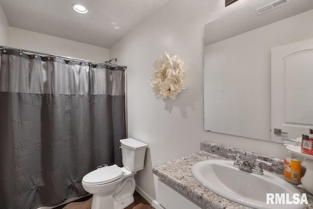 1708 Westport Dr, Davenport, IA 52804 - bathroom featuring visible vents, vanity, wood finished floors, toilet, and a shower with shower curtain