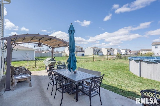 1708 Westport Dr, Davenport, IA 52804 - view of patio with a fenced in pool, a residential view, outdoor dining area, and a fenced backyard