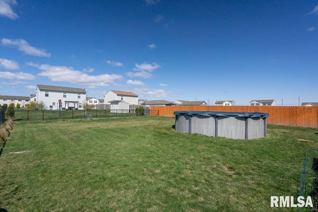 1708 Westport Dr, Davenport, IA 52804 - view of yard featuring a fenced in pool and fence