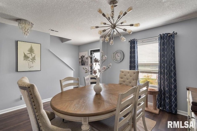1708 Westport Dr, Davenport, IA 52804 - dining room with baseboards, a chandelier, wood finished floors, and visible vents