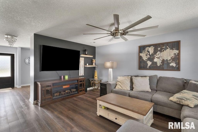 1708 Westport Dr, Davenport, IA 52804 - living room with baseboards, a ceiling fan, a textured ceiling, and wood finished floors