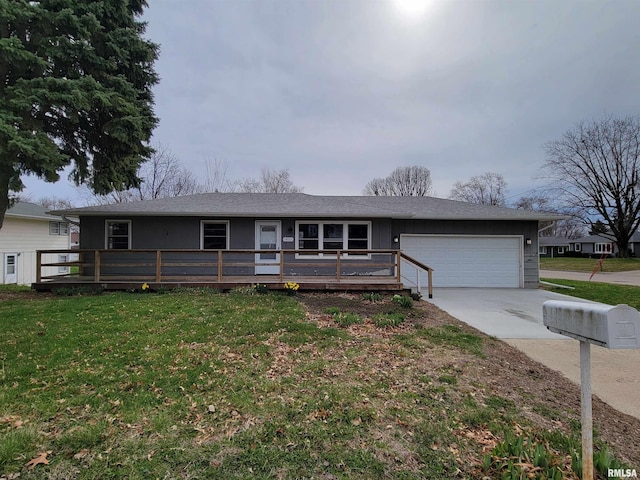 1803 N 7th St, Clinton, IA 52732 - ranch-style house featuring a garage, driveway, a front lawn, a wooden deck, and board and batten siding