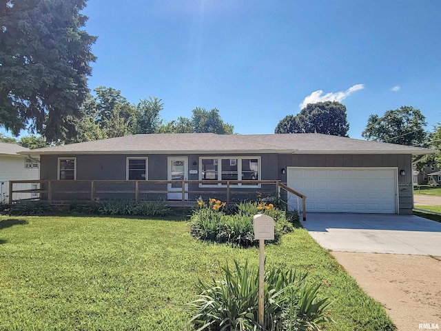 1803 N 7th St, Clinton, IA 52732 - single story home featuring a front yard, a garage, driveway, and roof with shingles