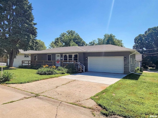 1803 N 7th St, Clinton, IA 52732 - ranch-style home with an attached garage, a front lawn, and driveway