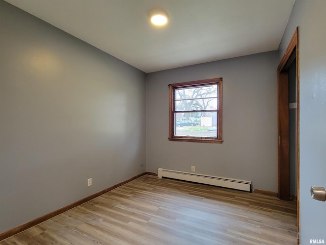 interior space featuring baseboards, baseboard heating, and light wood-type flooring