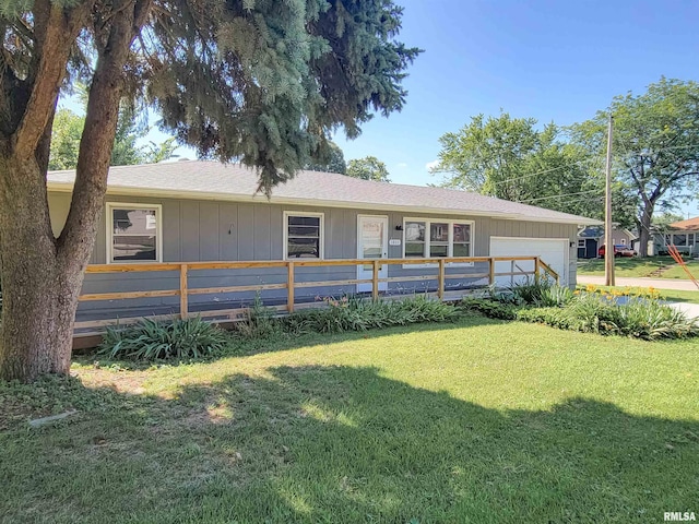 1803 N 7th St, Clinton, IA 52732 - view of front of home featuring an attached garage and a front lawn