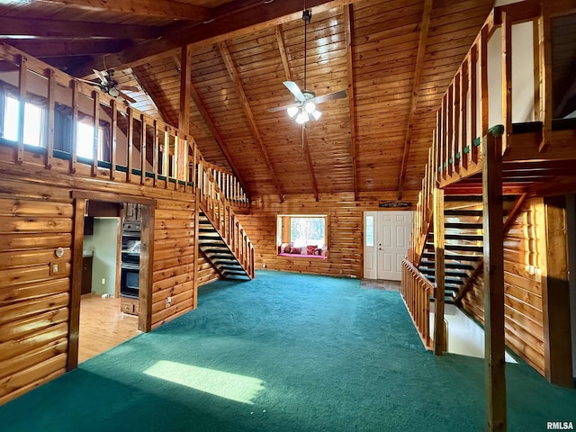 5453 Cherokee Ln, Carbondale, IL 62901 - unfurnished living room featuring wood ceiling, ceiling fan, beam ceiling, and carpet floors