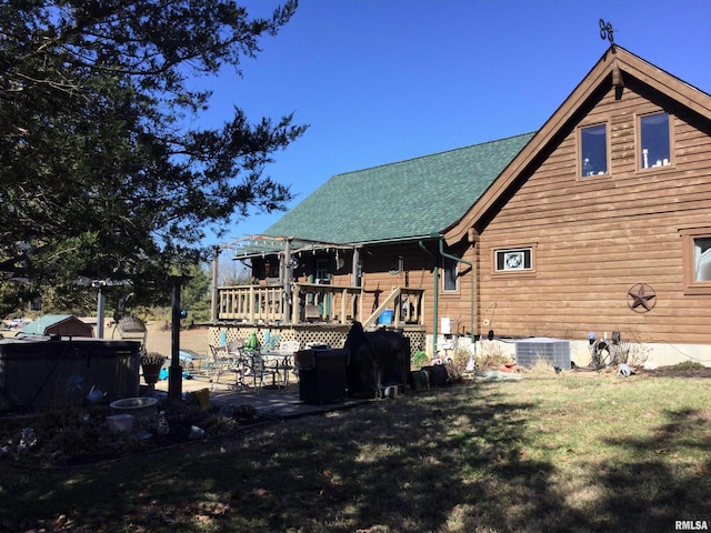 5453 Cherokee Ln, Carbondale, IL 62901 - back of house with a patio, central air condition unit, a swimming pool, a yard, and a shingled roof