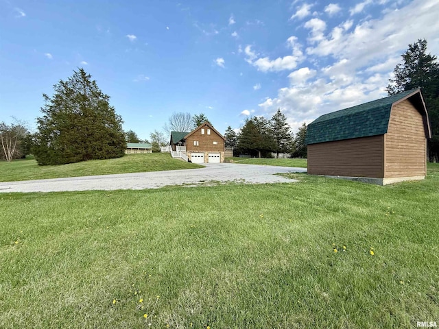 5453 Cherokee Ln, Carbondale, IL 62901 - view of yard featuring an outbuilding, a garage, and gravel driveway