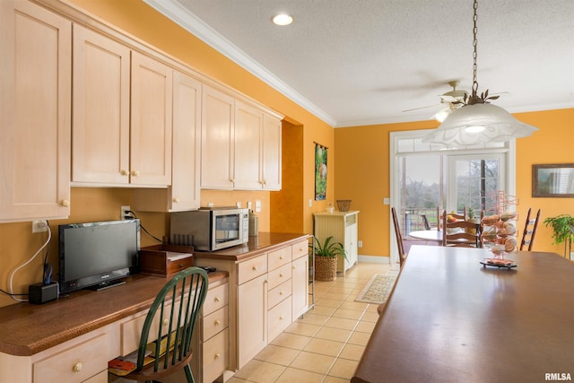 4996 Andrew Rd, Marion, IL 62959 - kitchen featuring stainless steel microwave, crown molding, light tile patterned floors, a ceiling fan, and built in desk