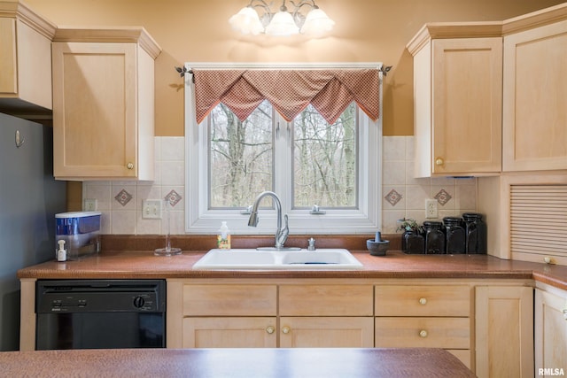4996 Andrew Rd, Marion, IL 62959 - kitchen with black dishwasher, light brown cabinetry, backsplash, and freestanding refrigerator