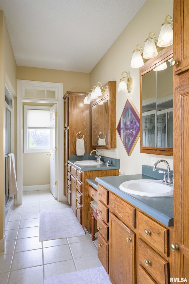 4996 Andrew Rd, Marion, IL 62959 - bathroom featuring tile patterned floors, two vanities, and a shower stall