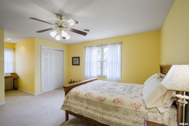 4996 Andrew Rd, Marion, IL 62959 - bedroom with light carpet, a textured ceiling, a ceiling fan, and a closet