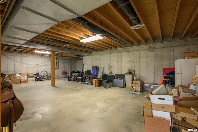 4996 Andrew Rd, Marion, IL 62959 - unfinished below grade area featuring freestanding refrigerator and electric panel