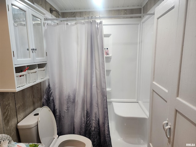 10 Womack Rd, Galatia, IL 62935 - bathroom featuring a shower with shower curtain, toilet, and wood walls