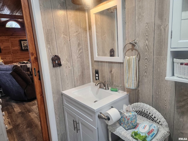 10 Womack Rd, Galatia, IL 62935 - bathroom with vanity, wood walls, and wood finished floors
