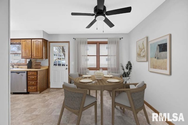 dining space featuring plenty of natural light and a ceiling fan