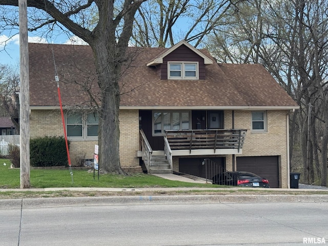 view of front of house with a garage, brick siding, and a shingled roof