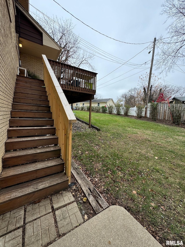 view of yard with stairs, a deck, and fence