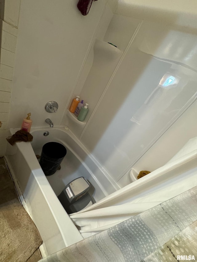 bathroom with shower / washtub combination