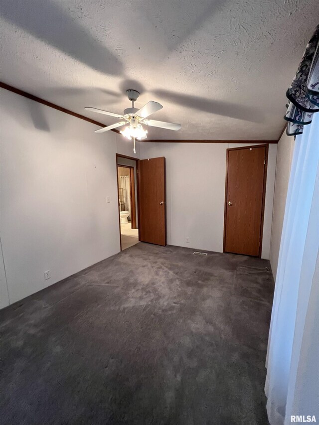 100 Little John Loop, Tunnel Hill, IL 62972 - unfurnished bedroom with crown molding, carpet floors, a textured ceiling, and a ceiling fan