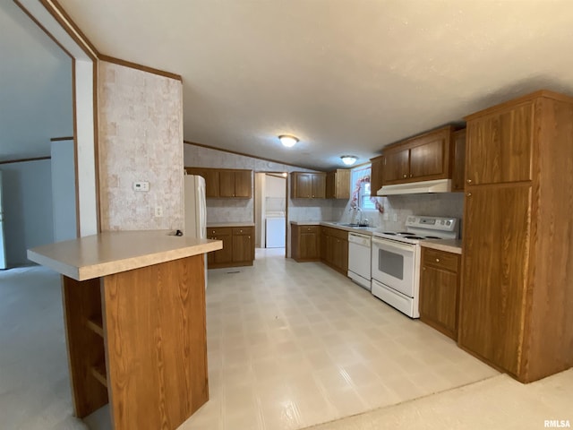 100 Little John Loop, Tunnel Hill, IL 62972 - kitchen with white appliances, a sink, under cabinet range hood, light countertops, and brown cabinetry
