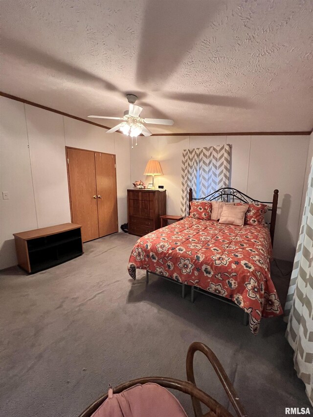 100 Little John Loop, Tunnel Hill, IL 62972 - bedroom featuring a textured ceiling, light colored carpet, ornamental molding, and a ceiling fan