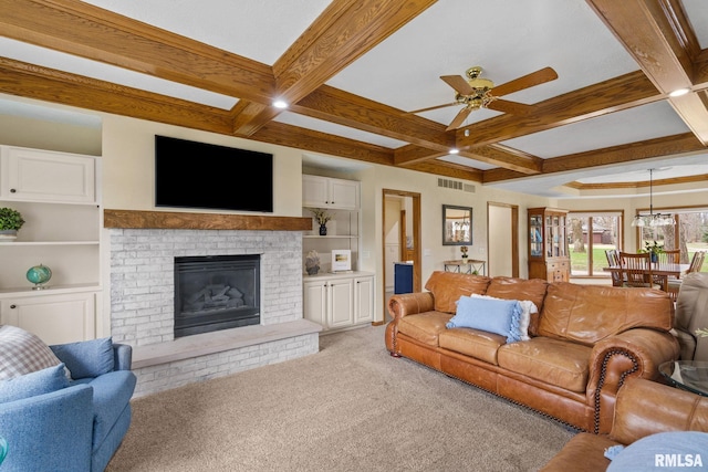 carpeted living room featuring coffered ceiling, beam ceiling, a ceiling fan, and baseboards