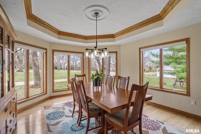 bedroom featuring light colored carpet, baseboards, a ceiling fan, connected bathroom, and a textured ceiling