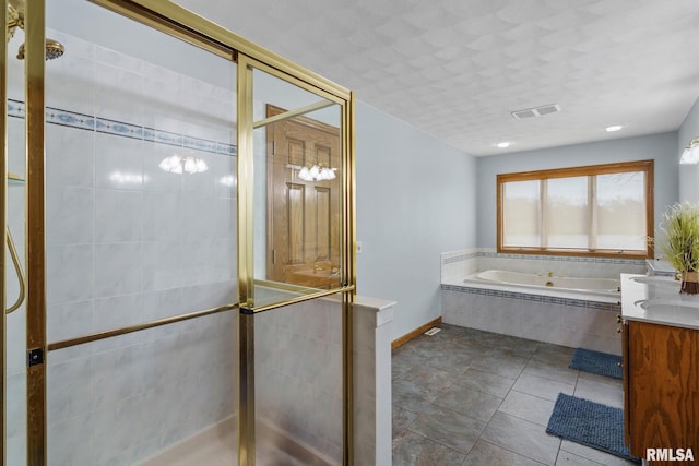 bathroom featuring a shower stall, a bath, tile patterned flooring, and vanity