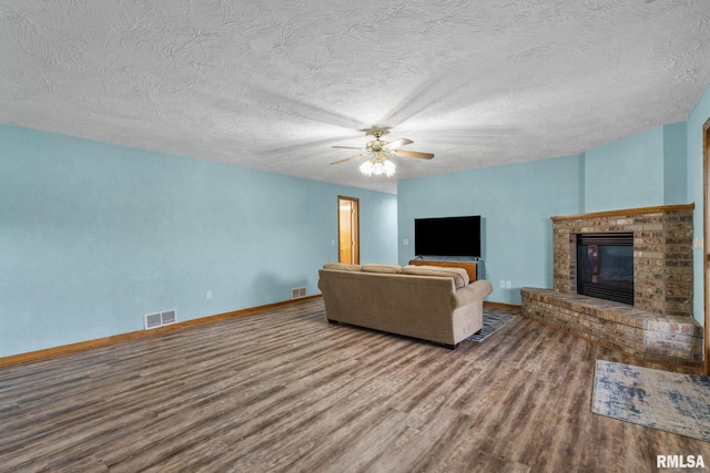 bedroom with access to exterior, wood finished floors, baseboards, a ceiling fan, and a textured ceiling