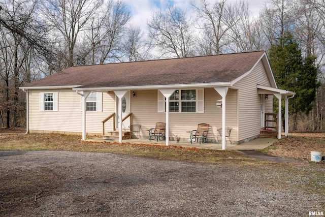 12855 Cleveland Ln, Pittsburg, IL 62974 - ranch-style house with entry steps and a shingled roof